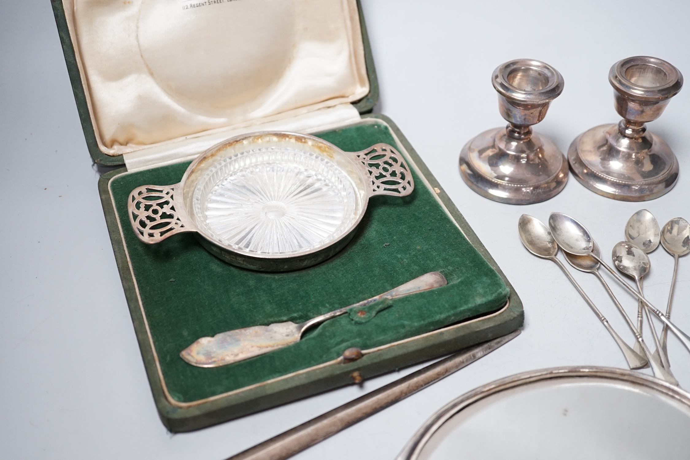 A George IV silver meat skewer, Robert Poulden, London, 1821, 30cm and other sundry silver including a George V bowl, a cased christening trio, pair of dwarf candlesticks, cased butter dish and knife, hand mirror etc.